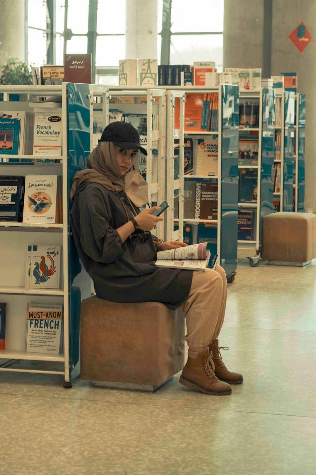 person reading book in library